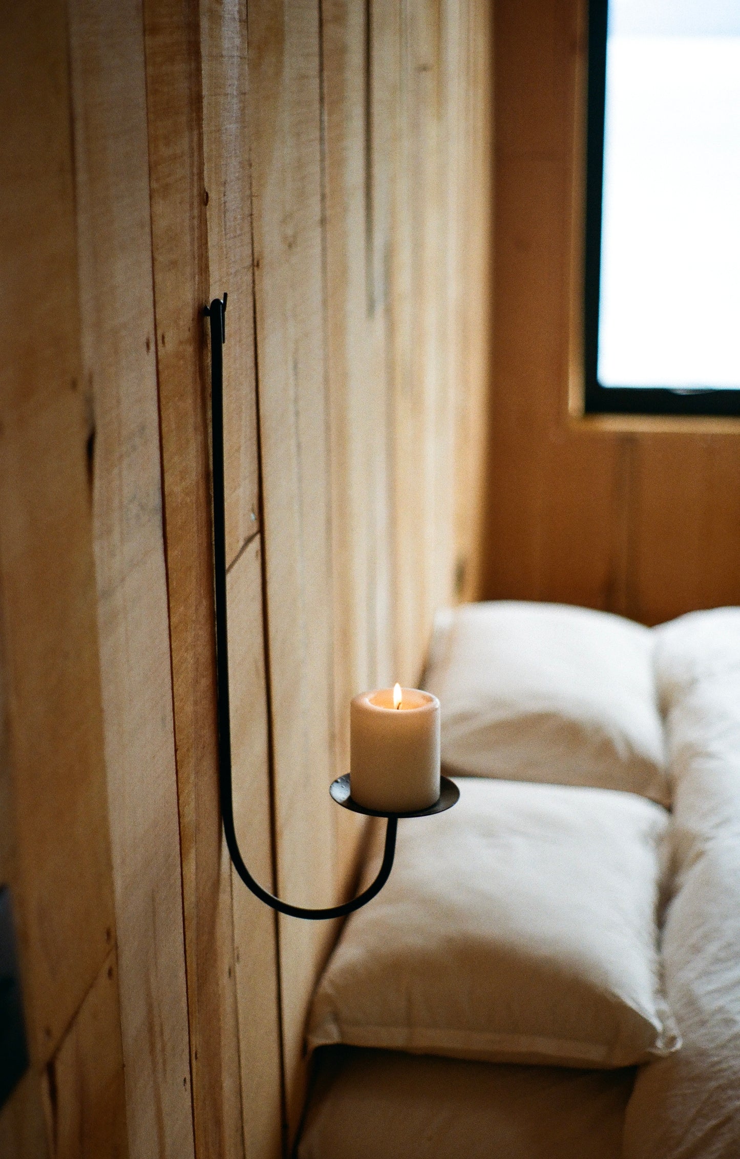 Sacra wall-mounted candle holder