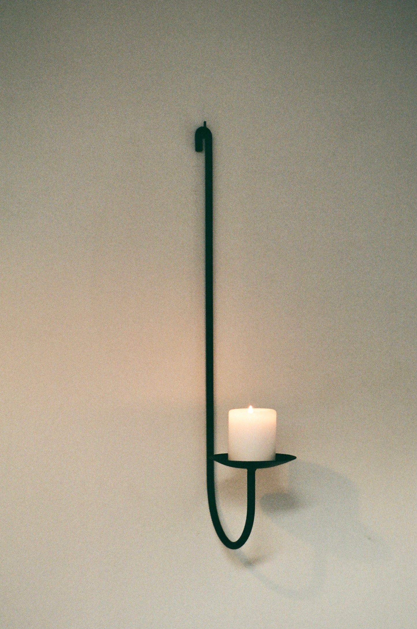 Sacra wall-mounted candle holder