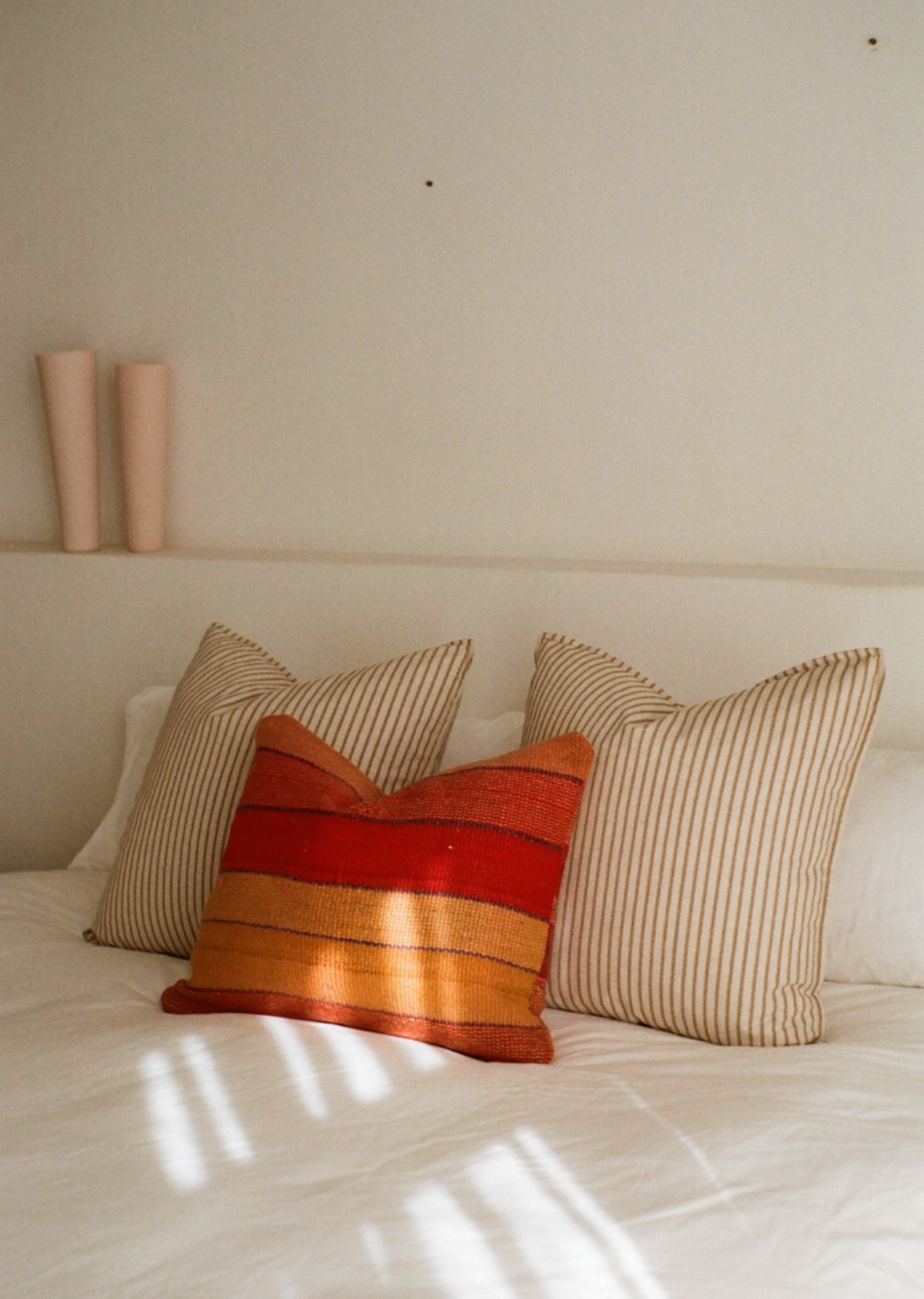 Red and orange striped cushion cover