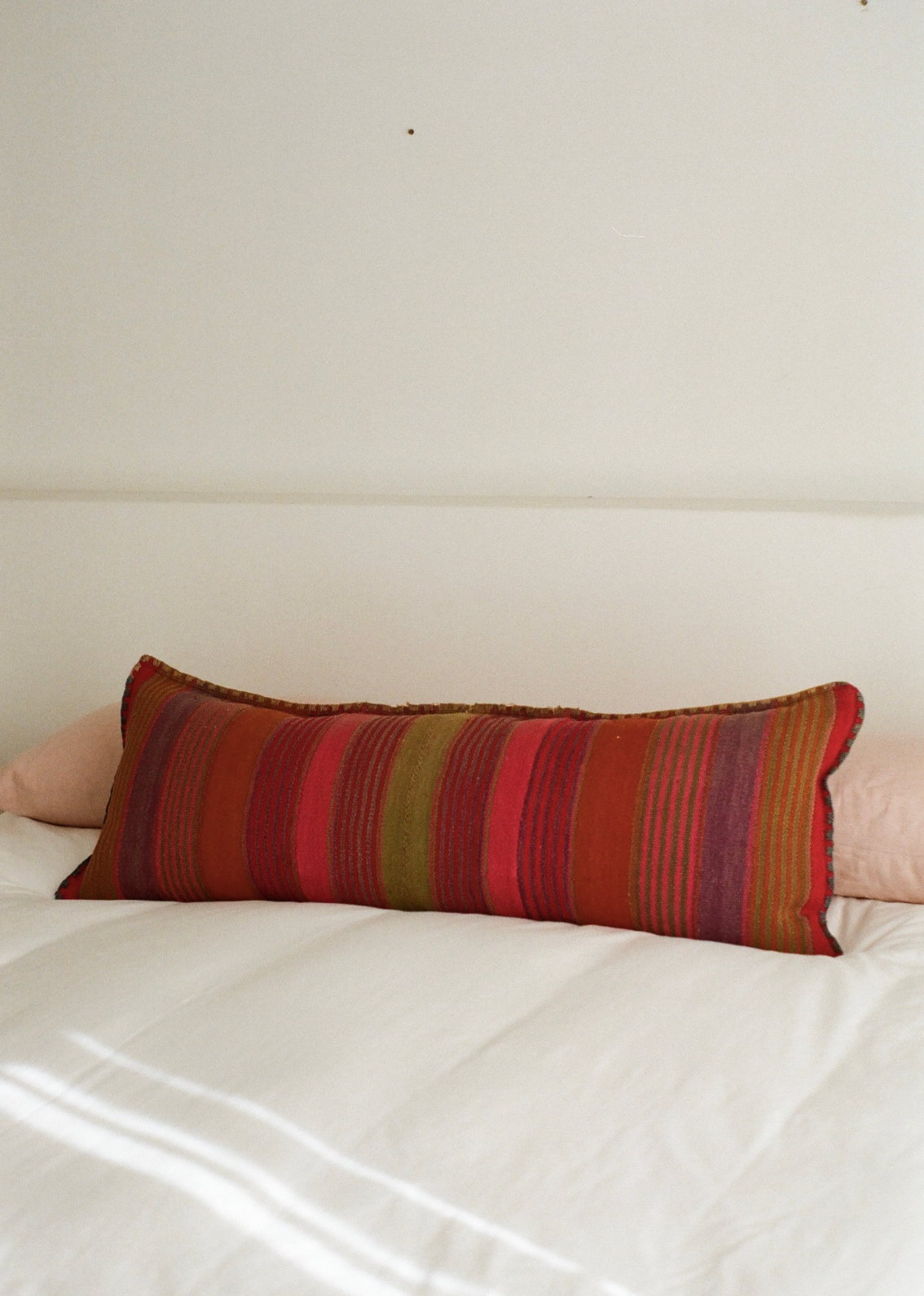 Oblong rainbow cushion cover