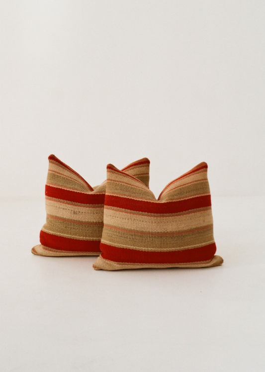 Red and teal striped cushion cover