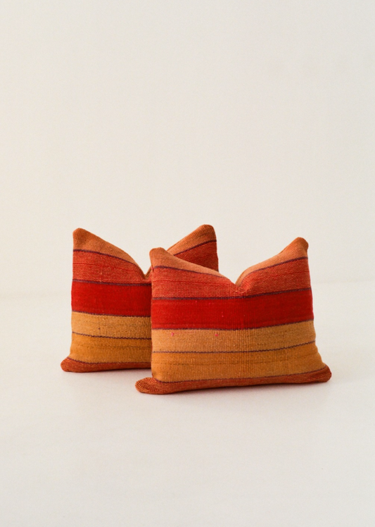 Red and orange striped cushion cover